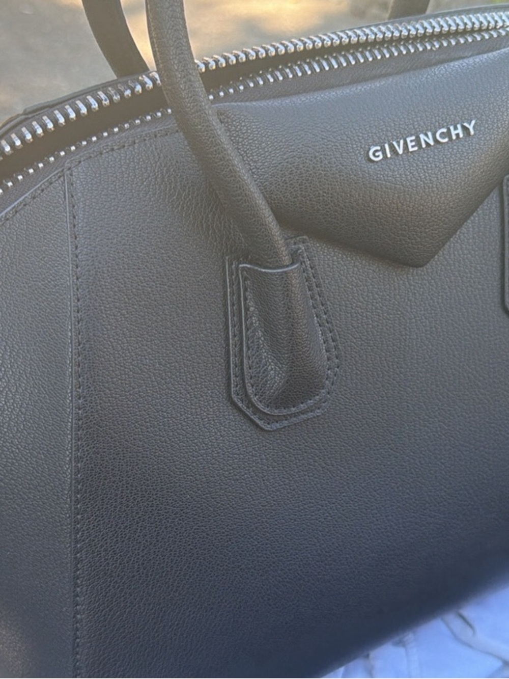 Black leather bag with strap